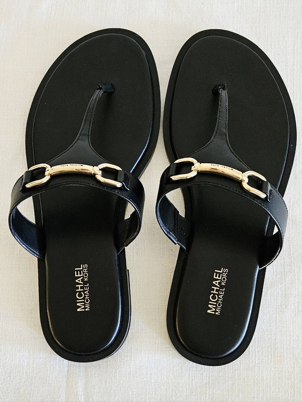 MICHAEL Michael Kors Carson Black Leather Thong Sandals with Gold-Tone Buckle